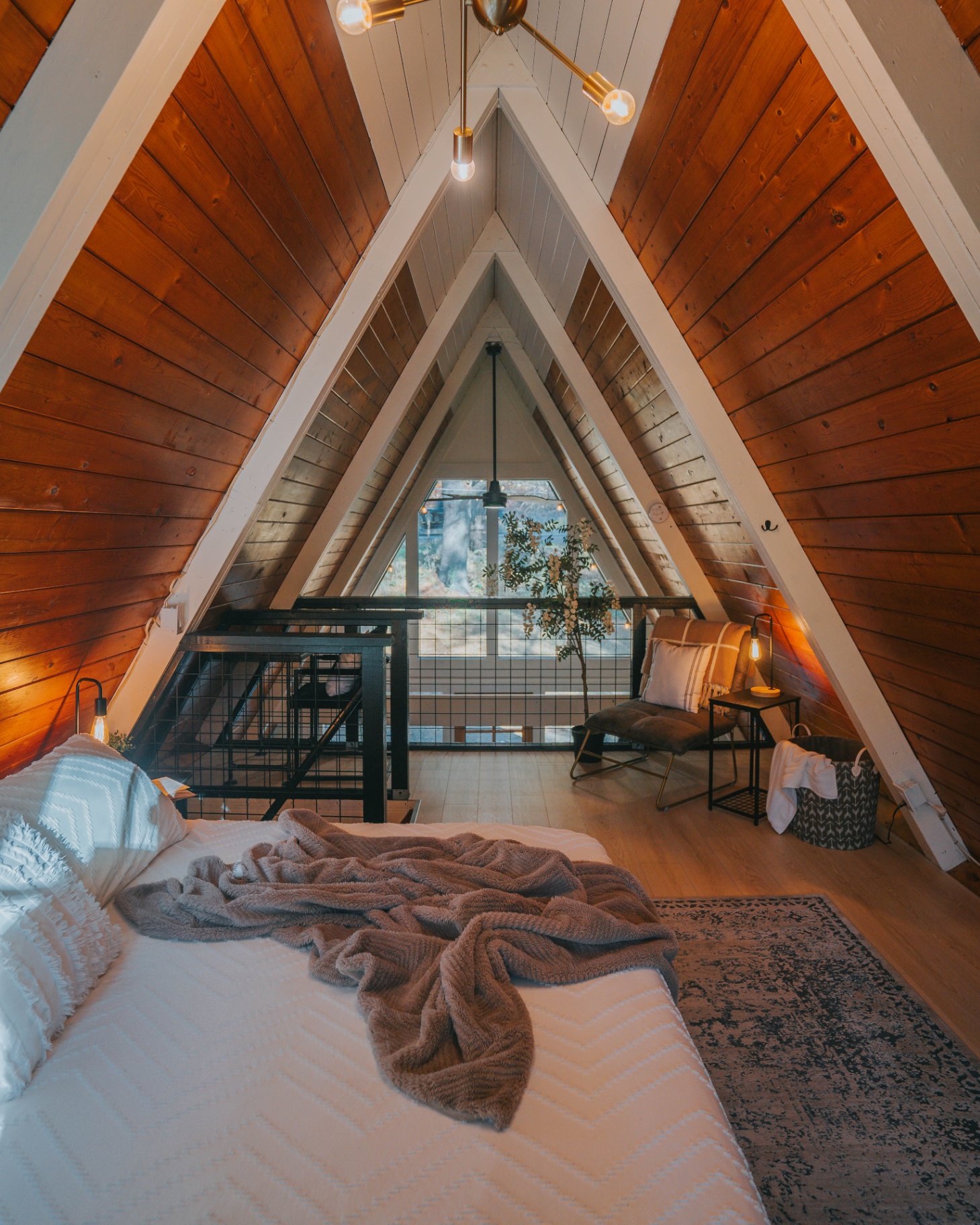 Loft interior after — king bed with private loft balcony